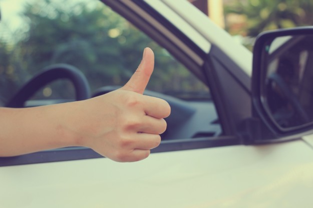 thumbs up out of car window