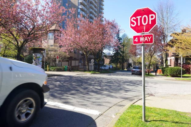 car stopped at a 4 way stop sign in Canada
