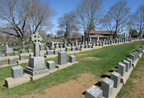 a large cemetery of grey headstones