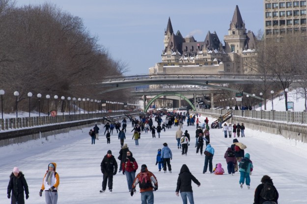 Rideau Canal full of ice skaters on a snowy day