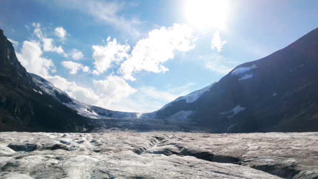 a glacier stretches through a valley
