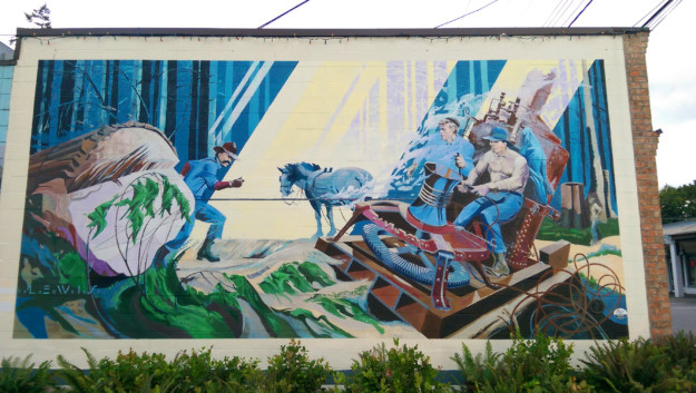 a mural celebrating logging and industry