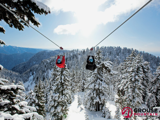 Skiers on a zipline at Grouse Mountain resort