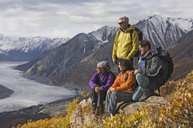 group of hikers perched on top of a mountain