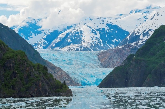 a bright blue glacier stretches off into the distance