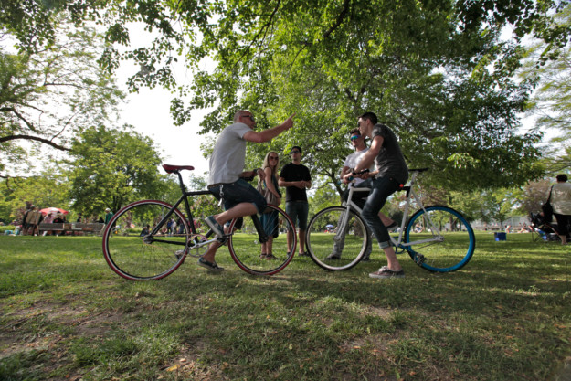 a group of people on bicycles stop for a chat