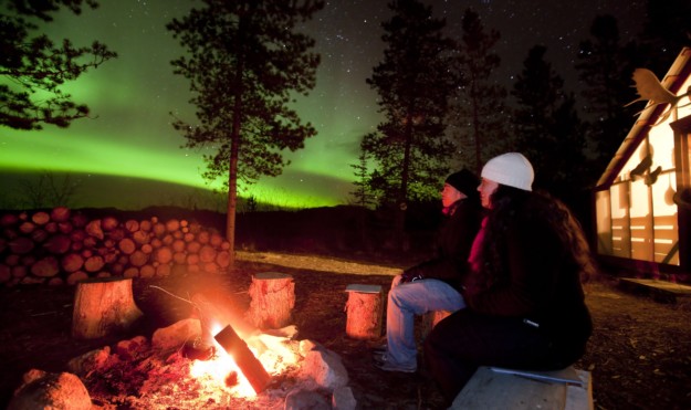 watching northern lights from a campfire