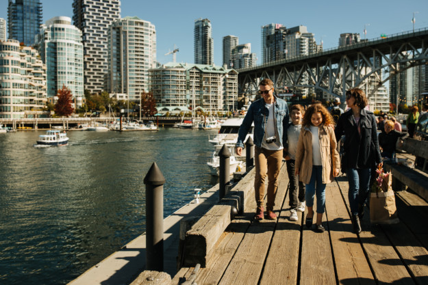 family walks along the Vancouver waterfront