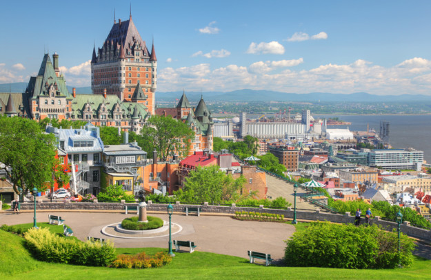Chateau Frontenac Hotel in Quebec City with a green promenade in the foreground