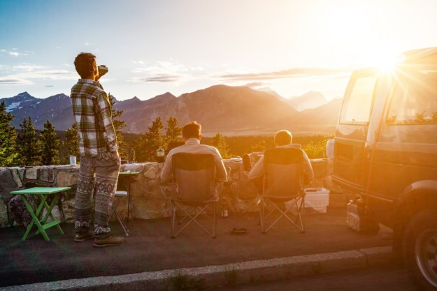 RV campers enjoy a magnificent sunset view of mountains in Canada