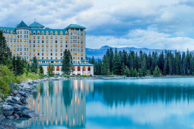 the fairmont chateau hotel sitting on the banks of the turquoise lake louise