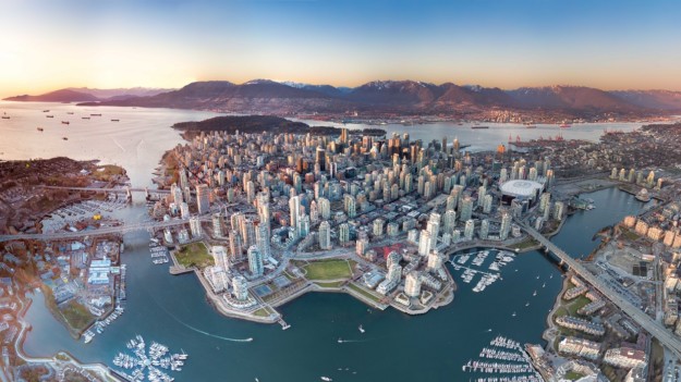 an aerial view of the Vancouver skyline at sunset
