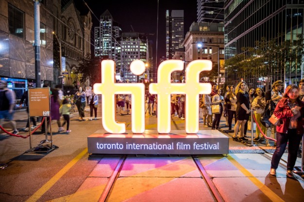 Toronto International Film Festival neon sign in a busy street