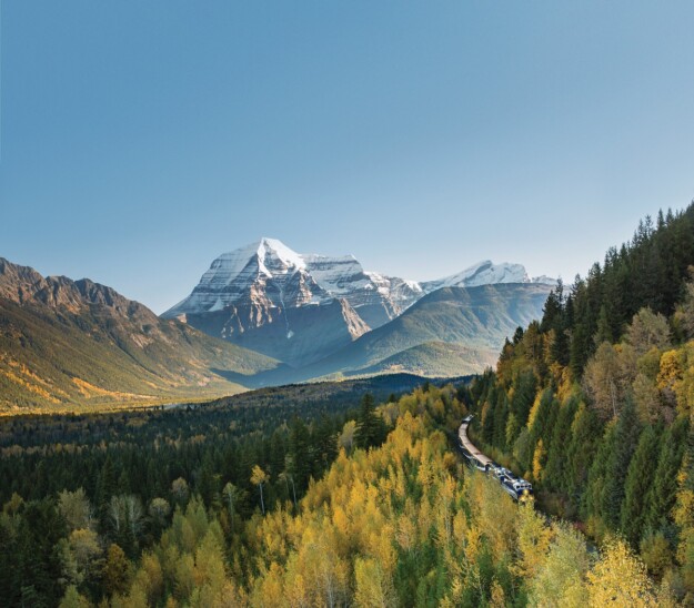 A Rocky Mountaineer train travels towards Mount Robson 