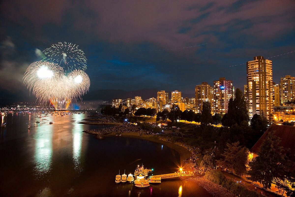 fireworks being launched from a platform in the sea in Vancouver