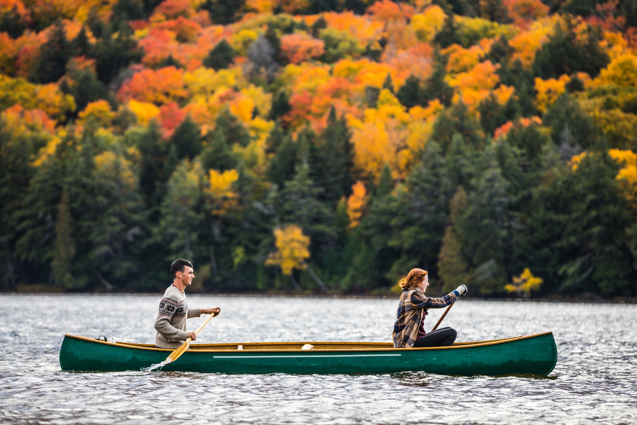 A couple canoeing on a lake in Algonquin Provincial Park