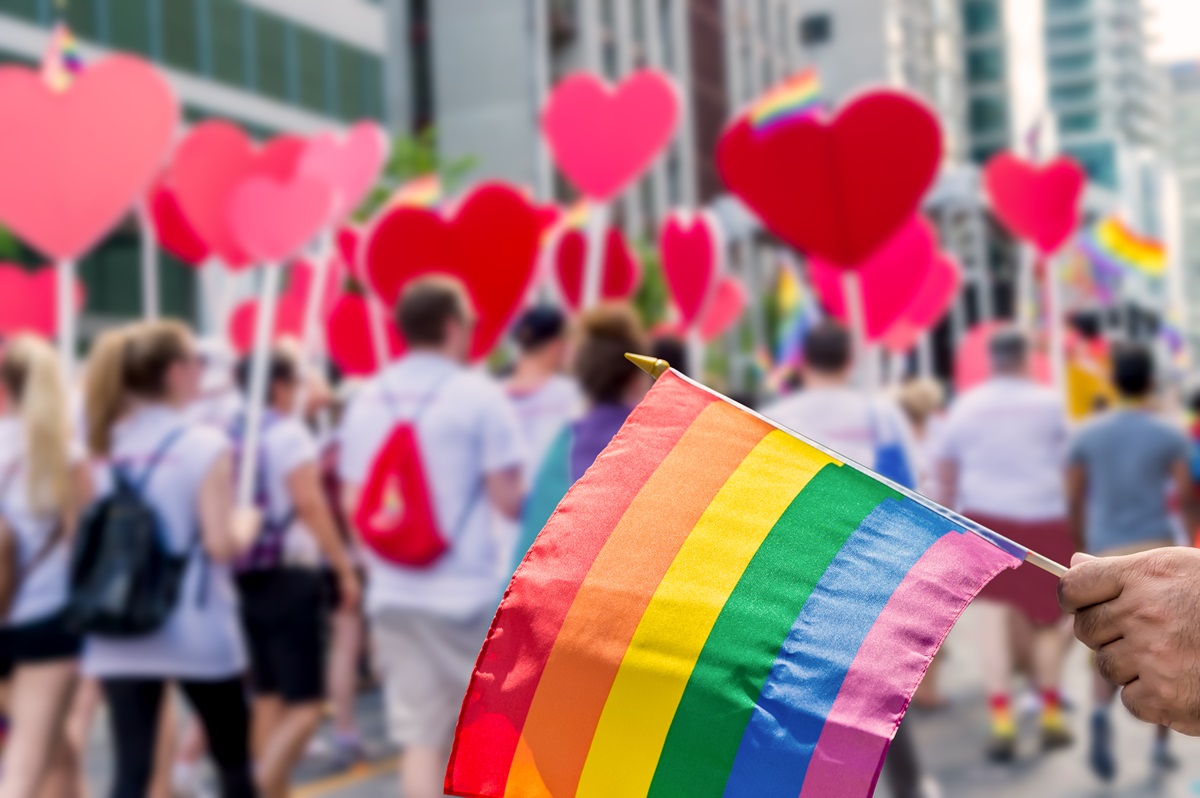 A Rainbow Flag being held during a parade at the Toronto Pride Festival