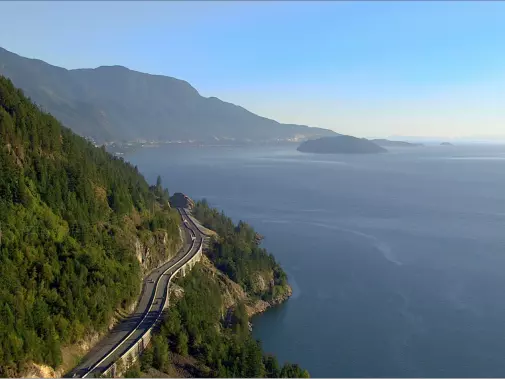 cars-driving-the-sea-to-sky-highway-between-vancouver-and-whistler-with-ocean-and-mountains-in-the-background-2-6805-credit---destination-bc.jpg