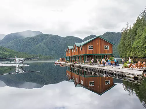 A serene lakeside scene where the seaplanes dock for Great Bear Lodge.