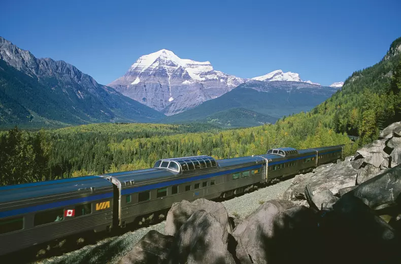 Via rail train passing through mountains