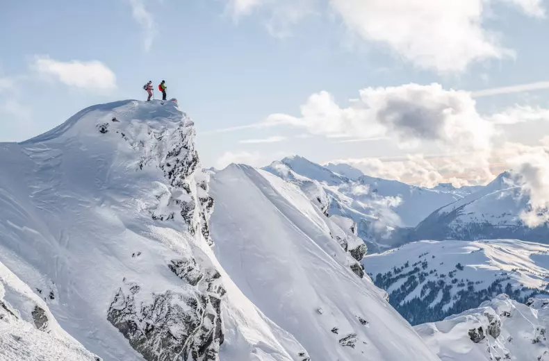 Two skiers on a snowy mountain in Whistler