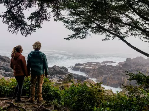 Looking out over the rocky west coast of Ucluelet, Canada with the waves crashing against the shore. 