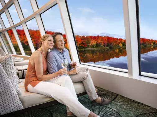 Enjoying the view on your cruise from the observation lounge onboard Norwegian Cruise Line.